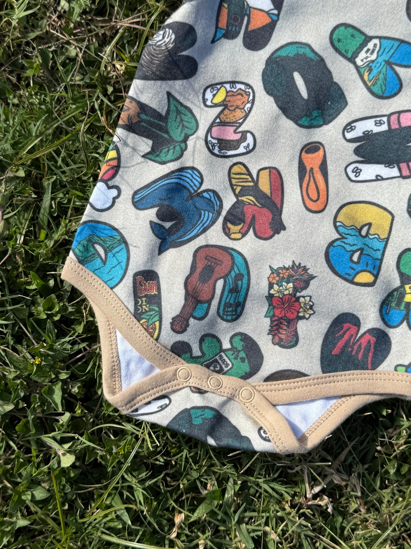 ALOHABETS BABY ONESIE